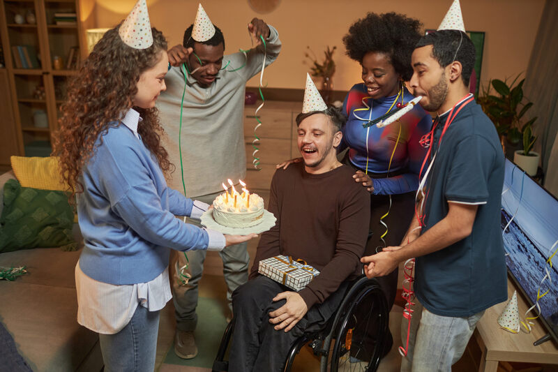 Community Participation - Woman Bringing Birthday Cake at Party